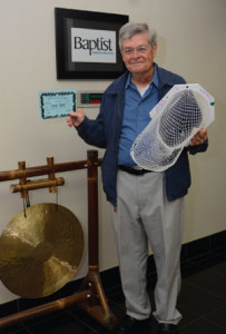 Keith rings the traditional gong at the Hederman Cancer Center to celebrate the end of his chemotherapy in his third journey with “terminal cancer.”