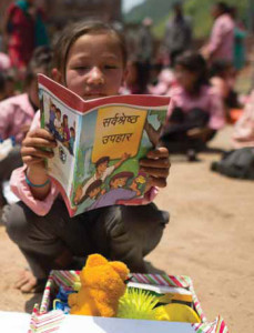Children in Nepal open their shoeboxes and discover “The Greatest Journey” written in their language.