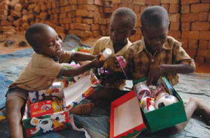 Boys in Uganda are eager to see what each other received in their shoeboxes.