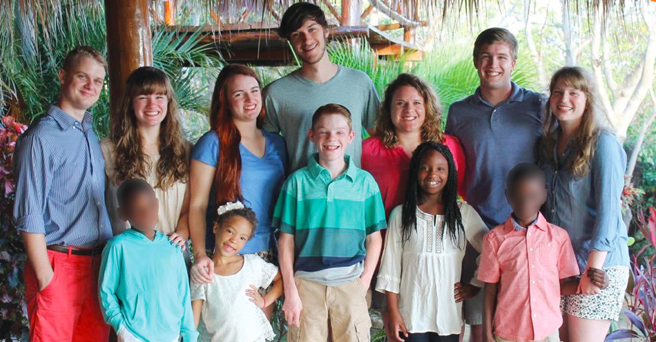 Back Row (L to R) Ethan Brockmann, Carlie Selman Brockmann, Ali Selman Berger, Alexander Berger, Emileigh Selman, Collin Selman, and Elizabeth McLoud Selman. Front row (L to R) Foster son #1, Ellie Grace Selman, Benjamin Selman, Jocelyn Selman, Foster son #2. (Mississippi’s Foster Care Governance laws do not permit the images or names of children who are still in custody of the state to be identified.)