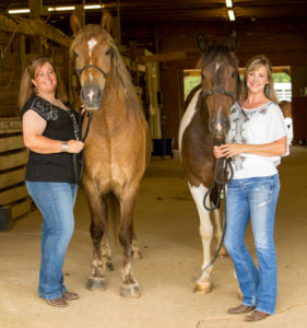Sarah Anderegg with Gabby who is also a nurse mare foal all grown up and Stephanie with an owner surrender named Reagan.