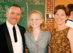 Angela (center) with her houseparents, Russ and Carolyn Akers.
