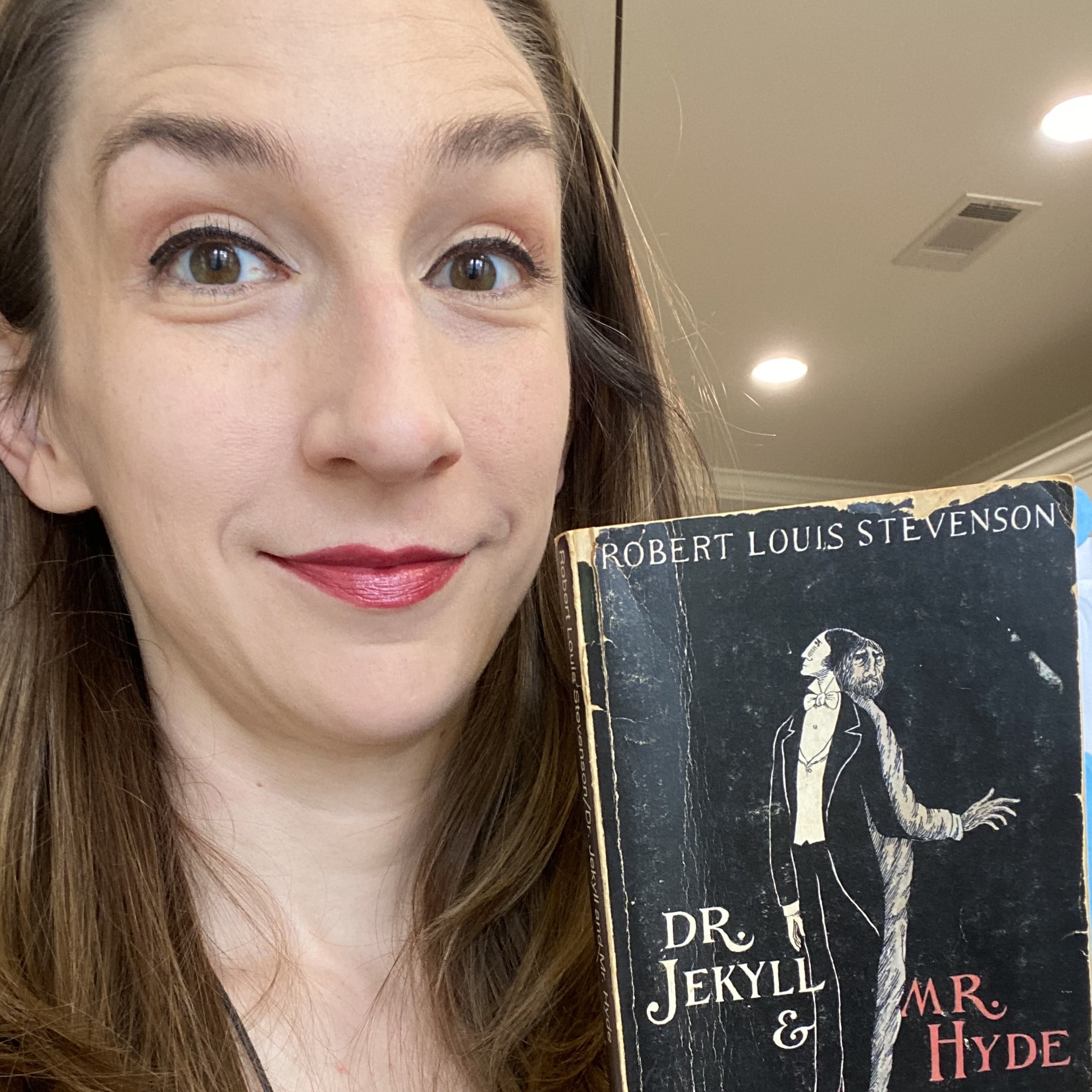 Katie Ginn holding a book
