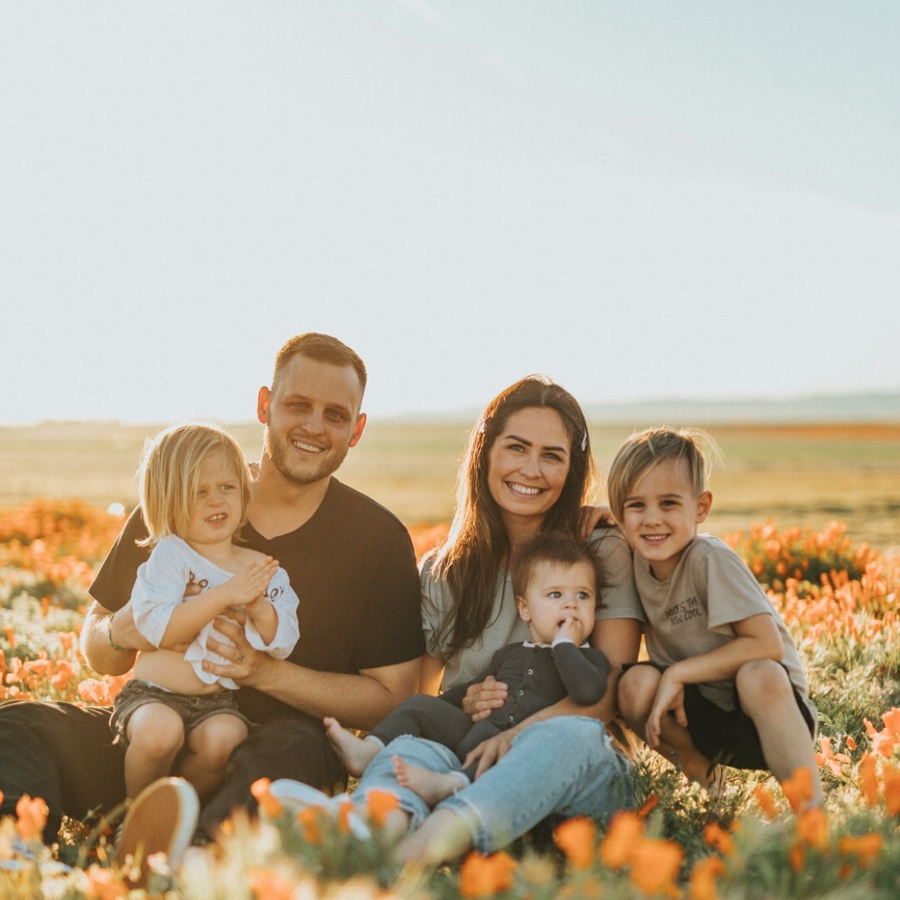 Family sitting in flowers